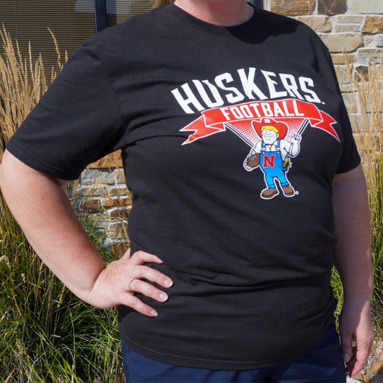 Herbie Husker Women's T-Shirt | Black | Multiple Sizes | Lou's Sporting Goods | 25N13DM104L