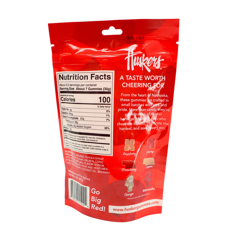 Red Huskers gummy candy package with nutrition facts label on a white background