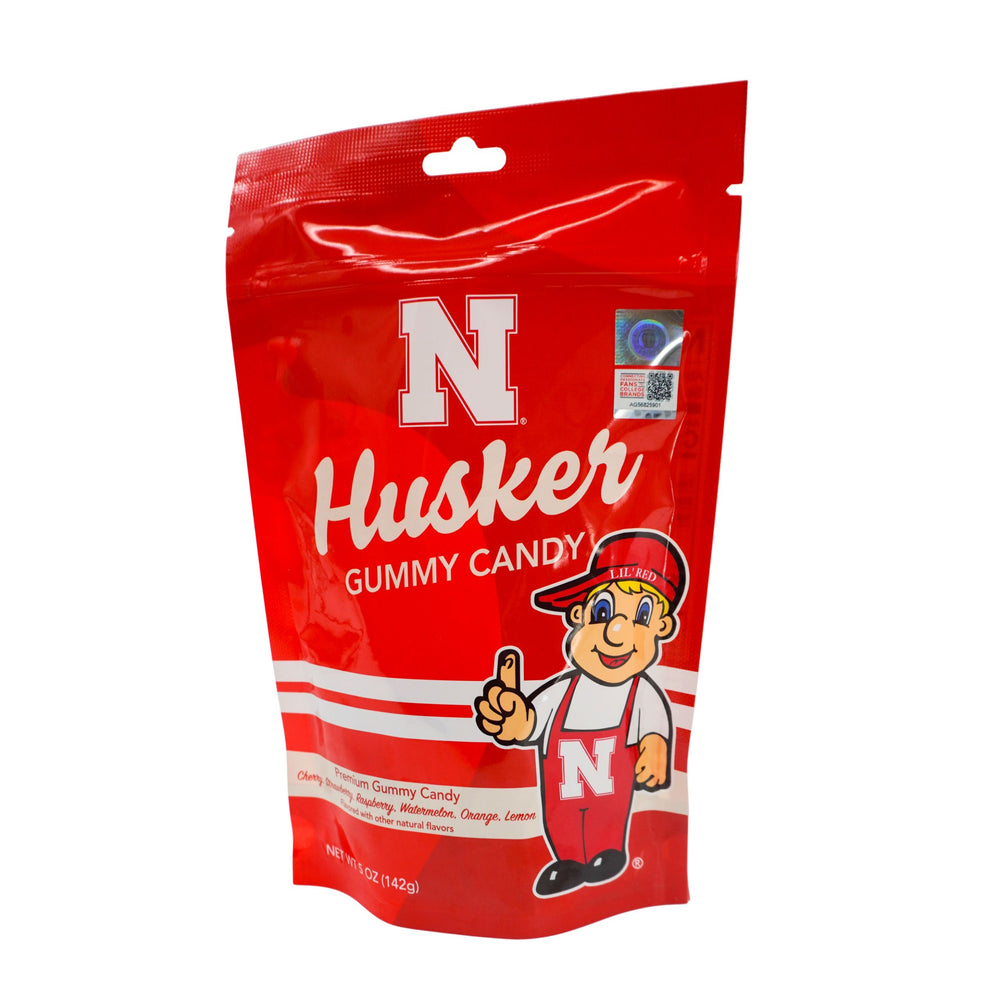 Red package of Husker Gummy Candy with a cartoon character on a white background