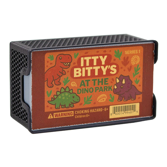 Toy packaging with dinosaur illustrations and 'Itty Bitty's at the Dino Park' text on a white background