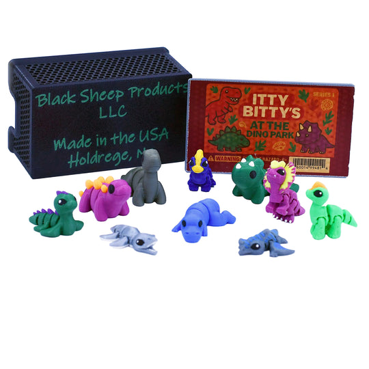 Set of colorful dinosaur figurines with packaging on a white background