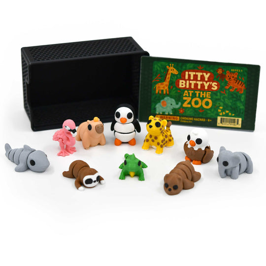 Set of small animal figurines with a box labeled 'Itty Bitty's at the Zoo' on a white background.