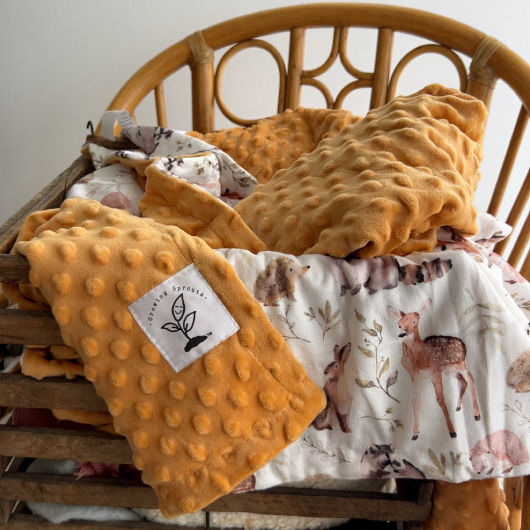 Yellow textured blanket with a label on a wooden chair against a white wall