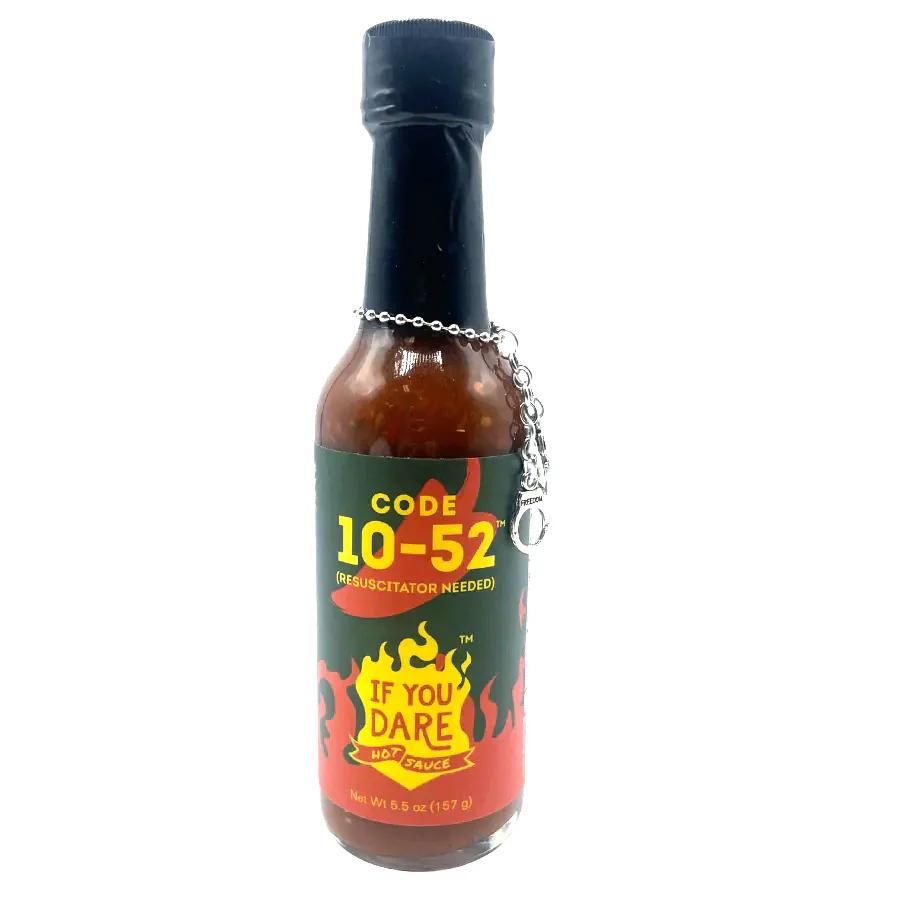 A bottle of Code 10-52 If You Dare Hot Sauce on a white background