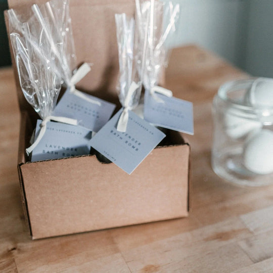 set of four lavender bath bombs in a shipping box