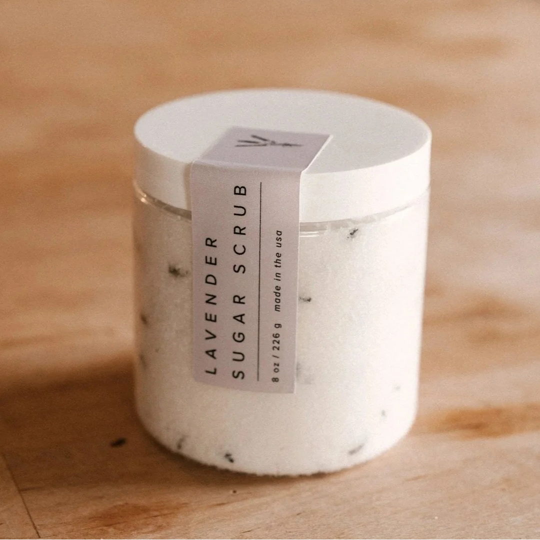 lavender sugar scrub by our lavender co on wood table