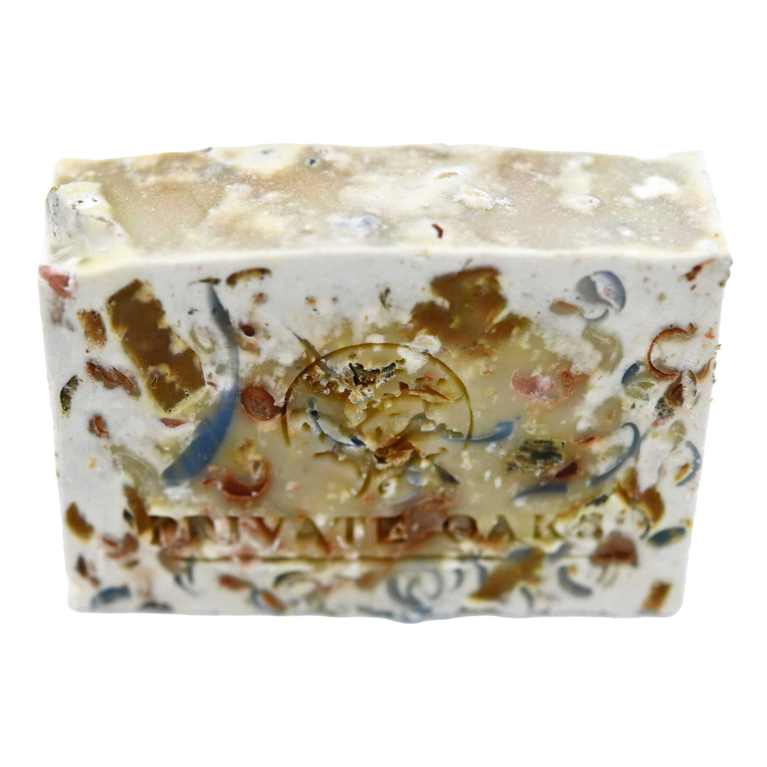 Decorative soap bar with multicolored specks on a white background