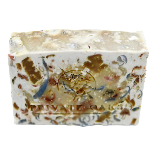 Decorative soap bar with multicolored specks on a white background
