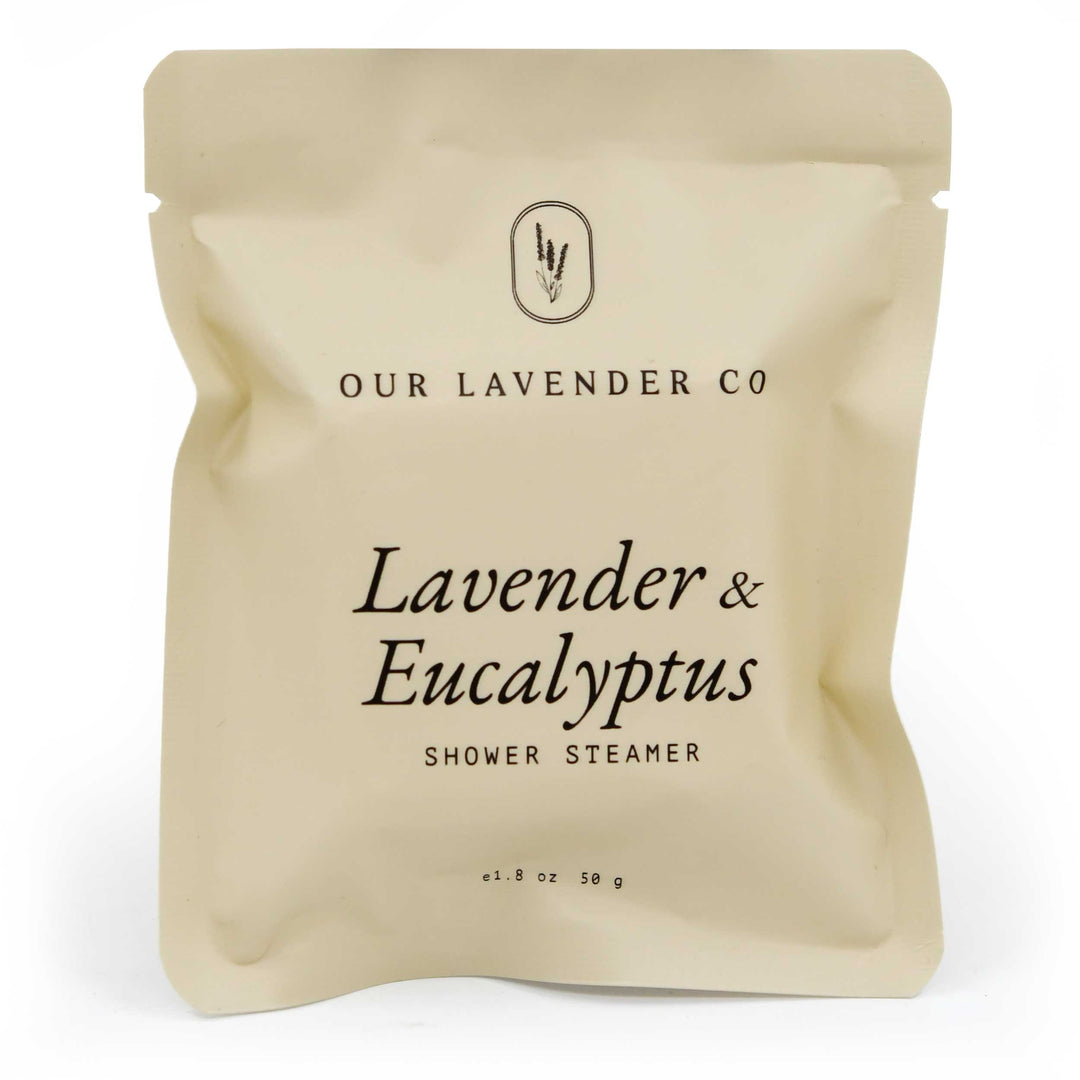 Beige packaging of a shower steamer with 'Our Lavender Co' branding on a white background