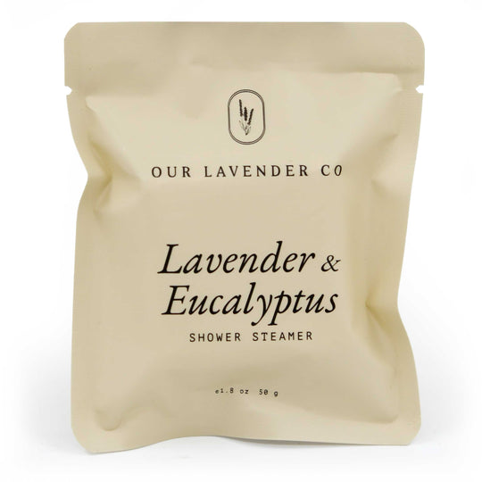 Beige packaging of a shower steamer with 'Our Lavender Co' branding on a white background