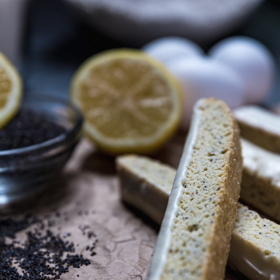 Lemon Poppyseed Biscotti | Subtle, Citrus Flavor | Light Crunch | Coated in Decadent White Chocolate | Perfect Addition To Your Morning Cup Of Tea or Glass of Wine | Omaha, Nebraska Biscotti | Taste of Bliss