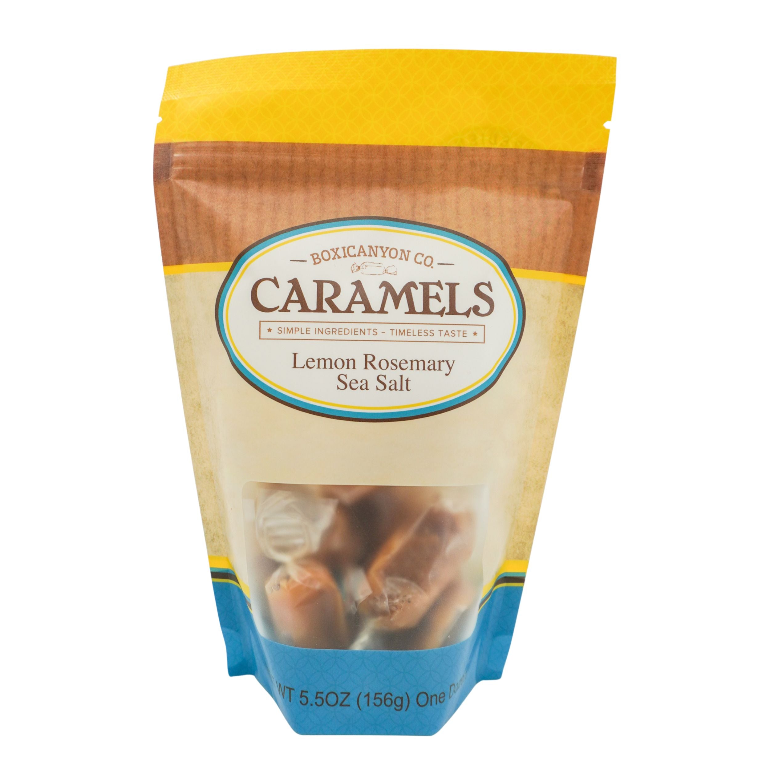 Packaged caramels with lemon rosemary sea salt flavor on a white background