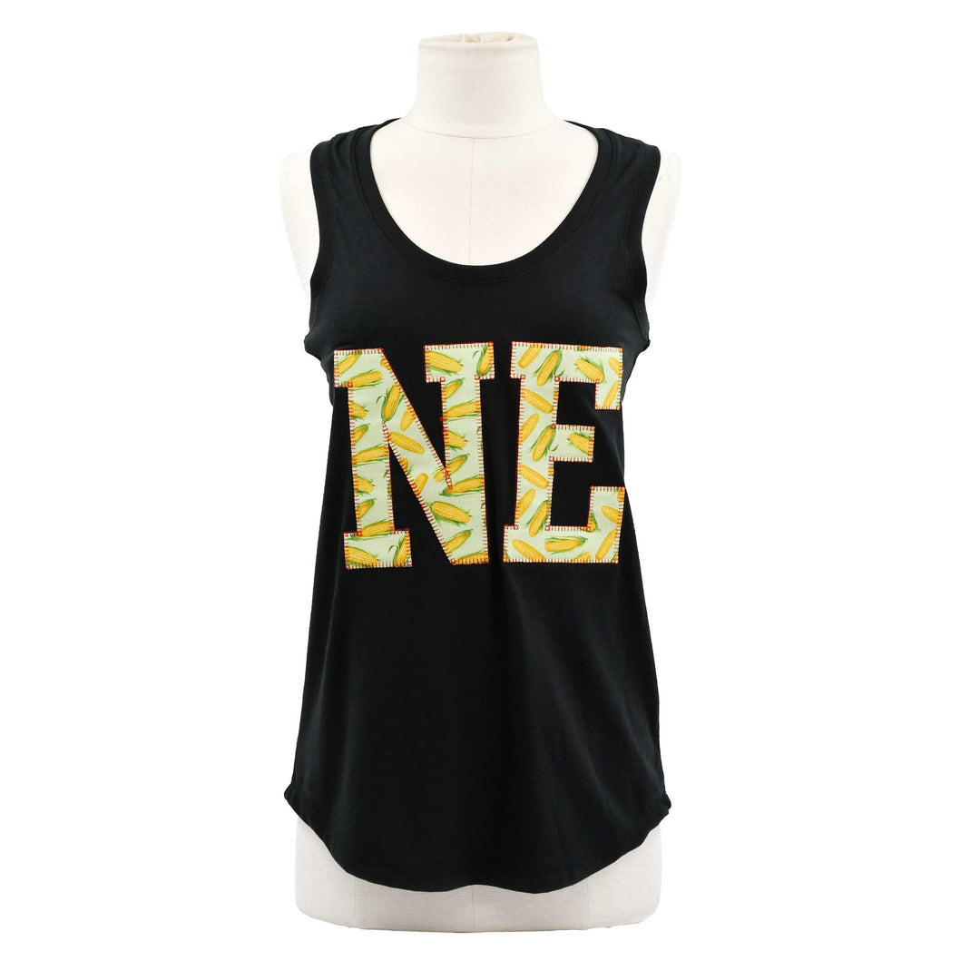 A black sleeveless tank top displayed on a white mannequin torso against a plain white background. The front features a large 'NE' graphic in yellow and white patterned lettering.