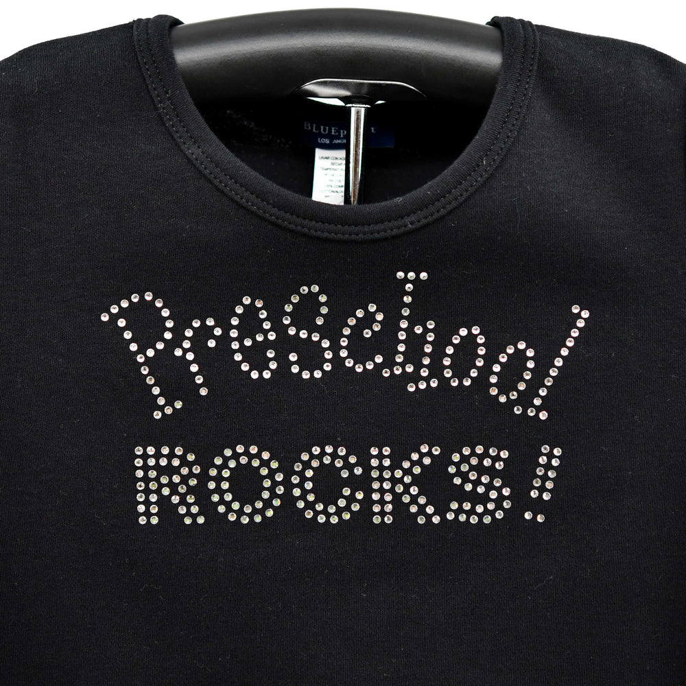 Black sweatshirt with 'Preschool ROCKS!' text in rhinestones on a hanger.