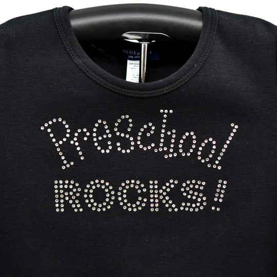 Black sweatshirt with 'Preschool ROCKS!' text in rhinestones on a hanger.