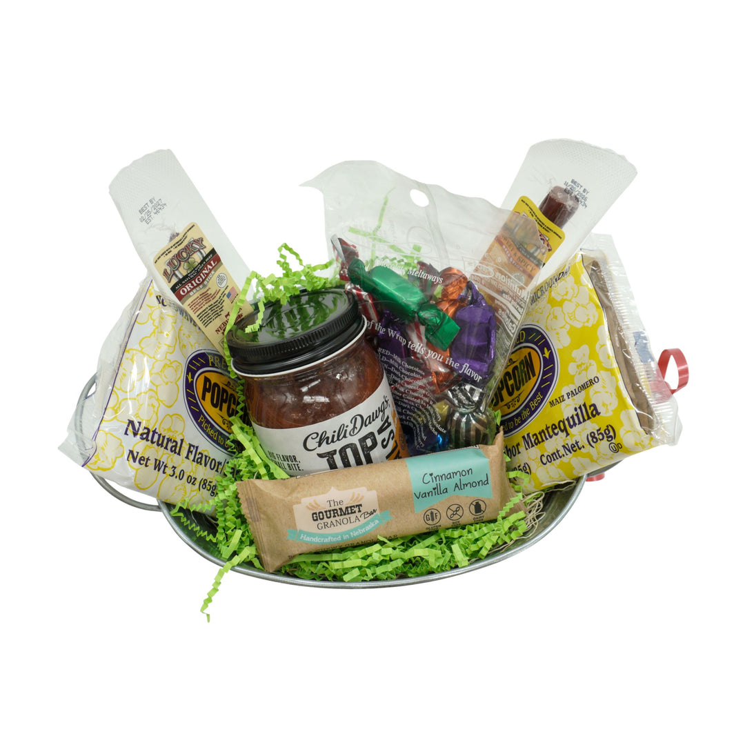 Assorted food items including a jar of salsa, a jar of salsa, and other packaged goods on a white background.