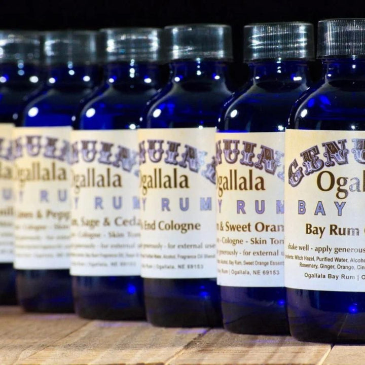 A variety of Ogallala Bay Rum Cologne/Aftershave on a wood table