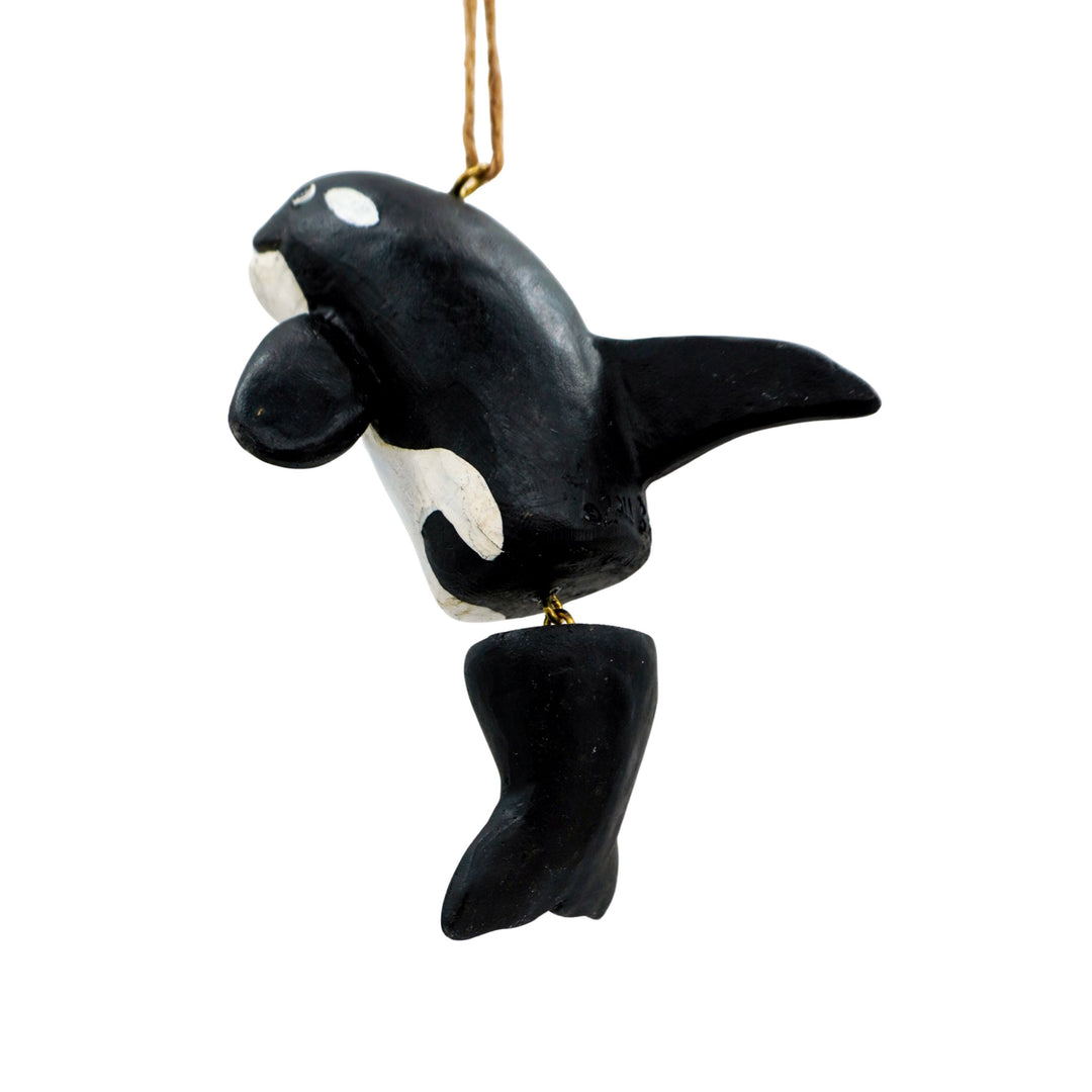 Black and white orca whale ornament on a white background