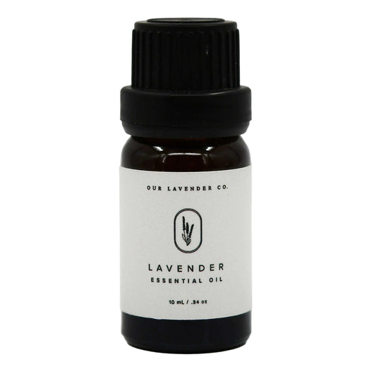 Bottle of lavender essential oil with a black cap on a white background