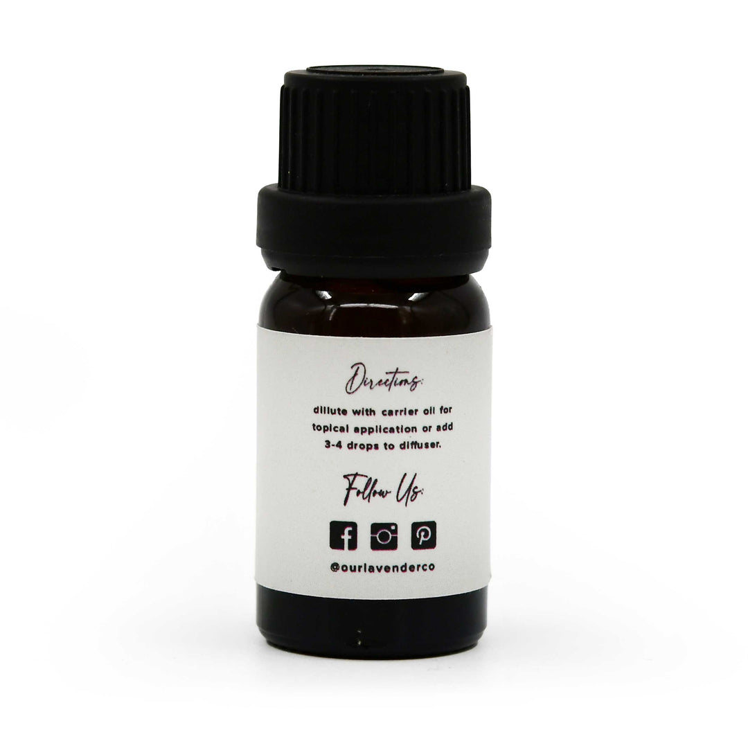 Small black bottle with a white label on a white background