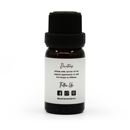 Small black bottle with a white label on a white background