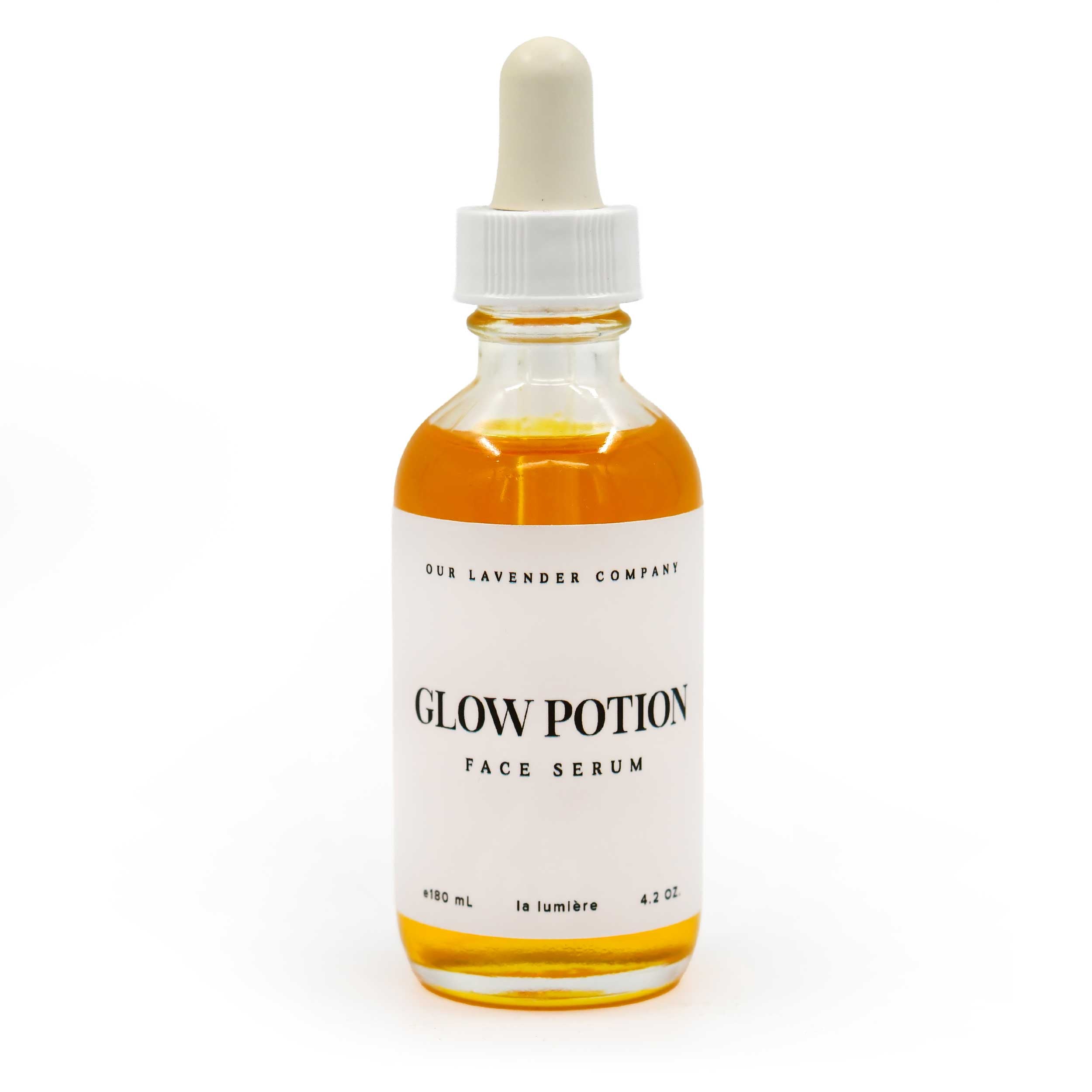 Bottle of 'Glow Potion' face serum with a white label on a white background
