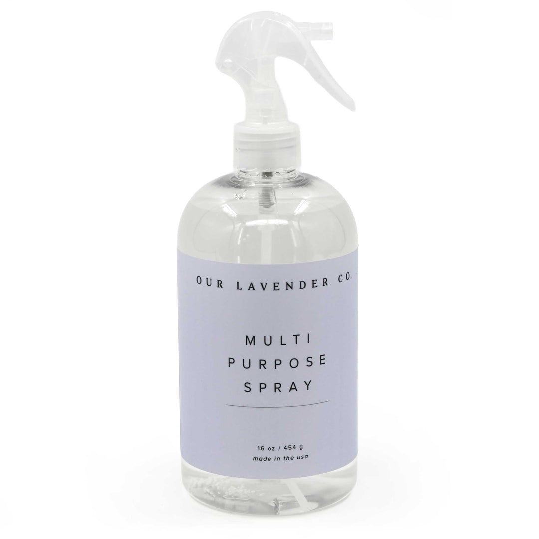 Clear spray bottle with lavender label on a white background