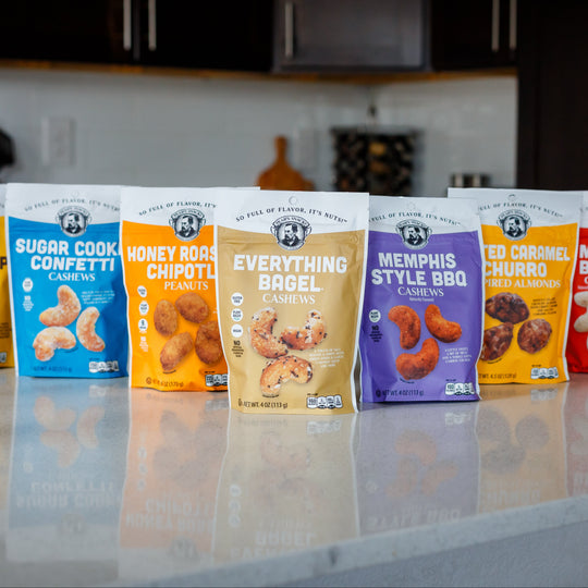 Assorted snack bags on a kitchen counter with blurred background