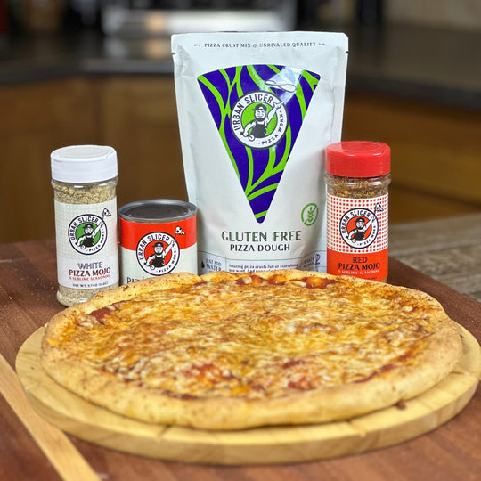 Pizza with pizza dough, sauce, and seasoning on a wooden board