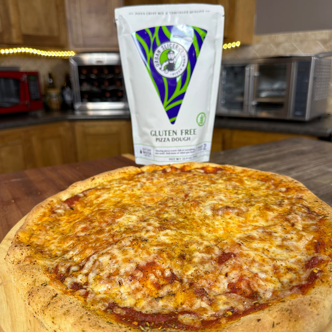 Gluten-free pizza with a package of gluten-free pizza dough on a wooden board in a kitchen setting.