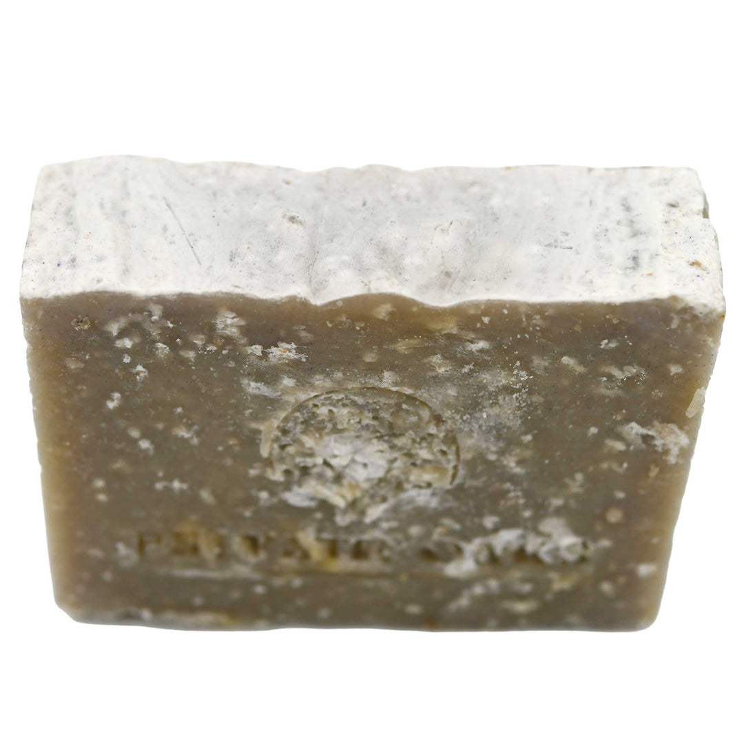 Bar of soap with a visible brand logo on a white background
