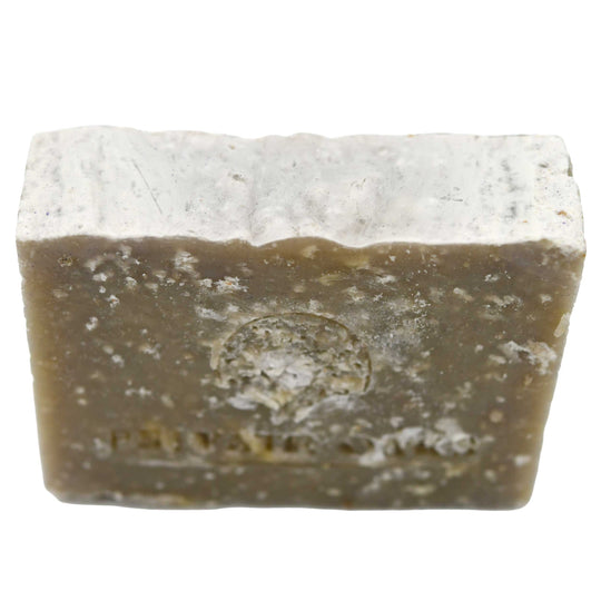 Bar of soap with a visible brand logo on a white background