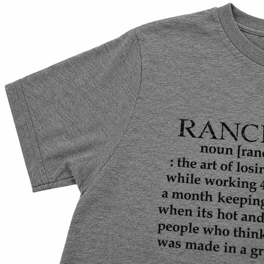 A close-up of a heather gray short-sleeve t-shirt showing a black printed dictionary-style definition of the word 'RANCH' on the front, set against a plain white background.