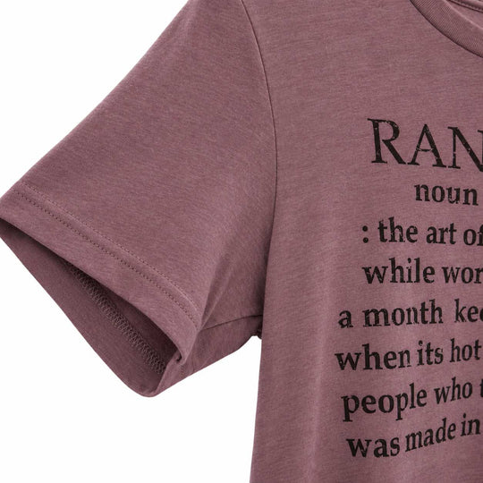 Close-up of a mauve-pink short-sleeve t-shirt with black printed text on the front, shown against a plain white background.