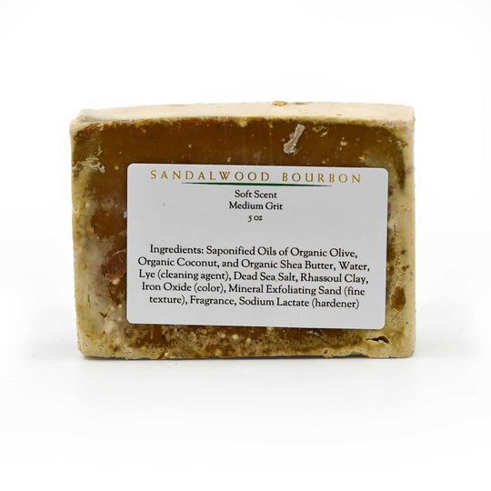 Bar of sandalwood bourbon soap with a label on a white background