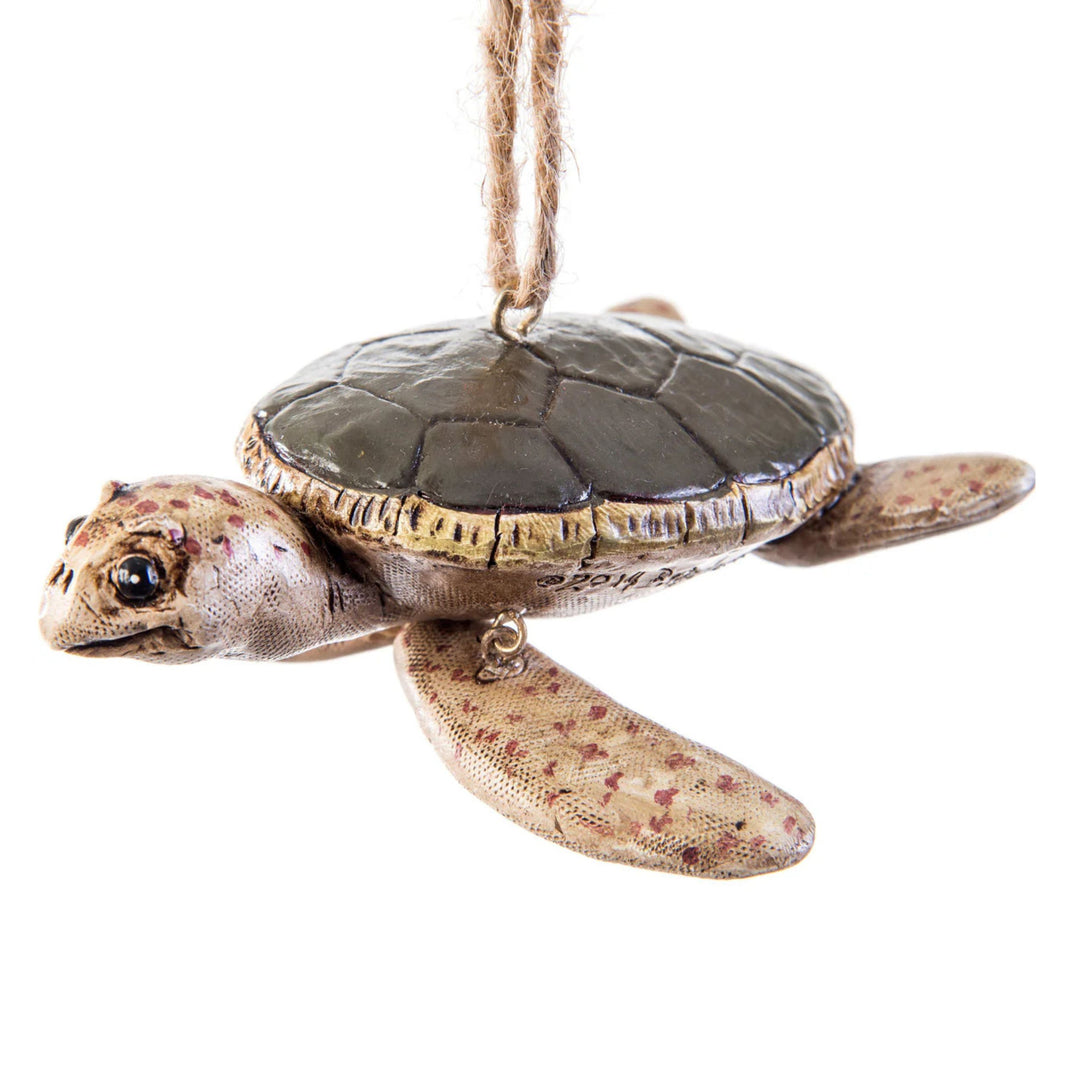 Decorative turtle ornament on a white background