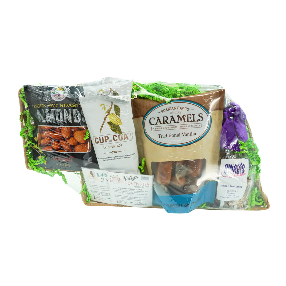 Assorted food items including caramels and almonds in a clear package on a white background