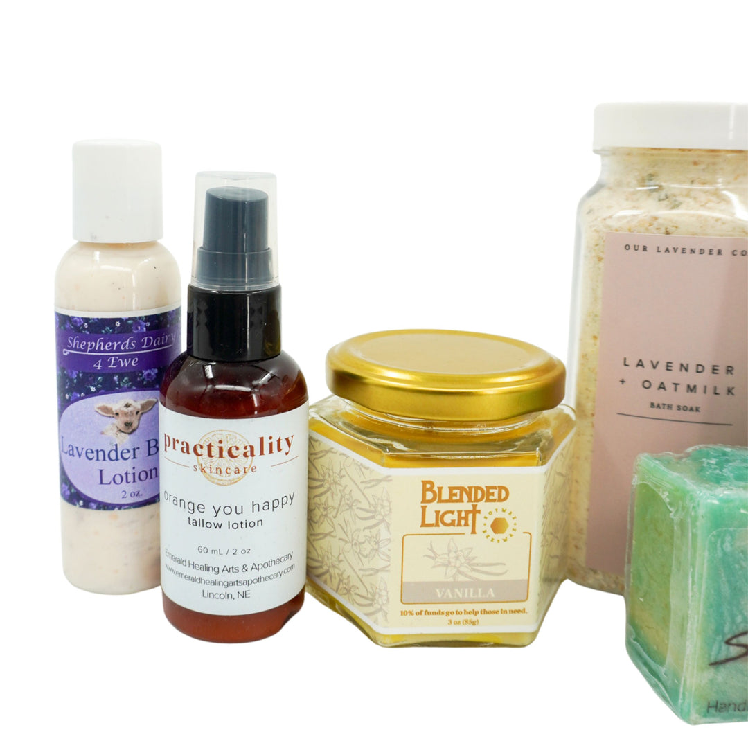 Collection of skincare and wellness products including lotion, spray, jar, and soap on a white background.