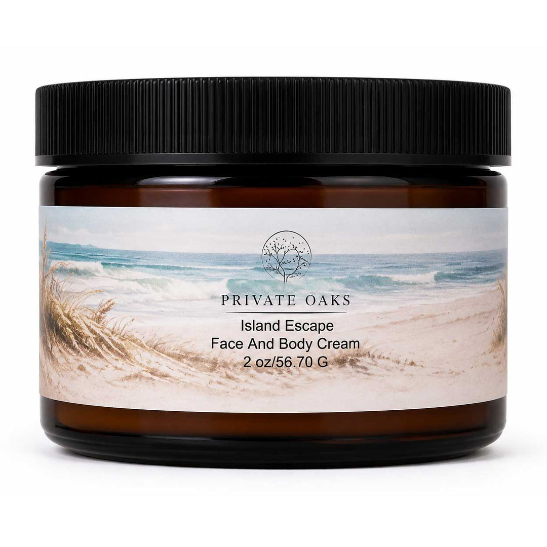 An amber glass jar of Private Oaks Island Escape Face And Body Cream with a black ribbed lid, featuring a beach-themed label on a white background.