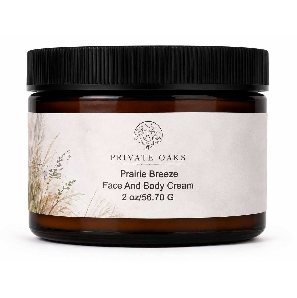 A jar of Private Oaks Prairie Breeze Face And Body Cream in an amber glass jar with a black ribbed lid and a textured off-white label, shown on a white background.