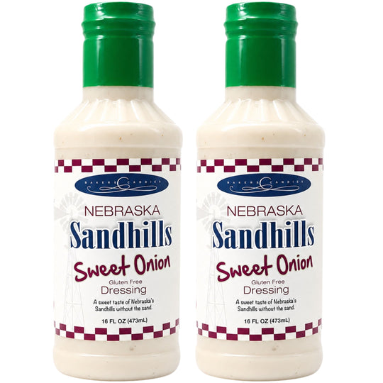 Two bottles of Nebraska Sandhills Sweet Onion Dressing on a white background