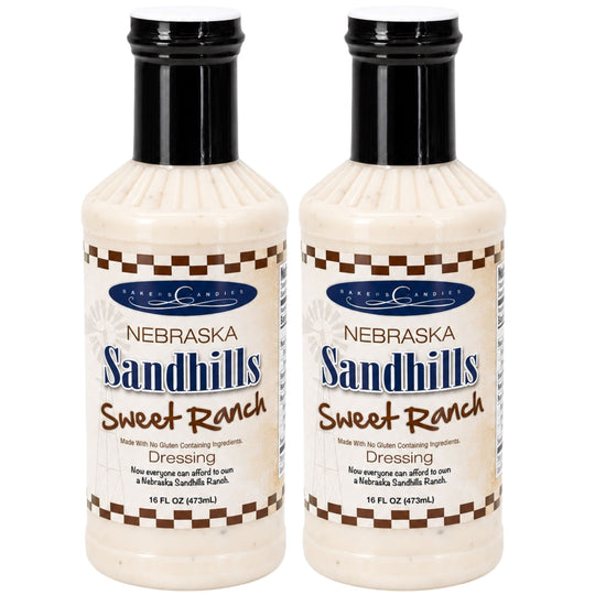 Two bottles of Nebraska Sandhills Sweet Ranch dressing on a white background