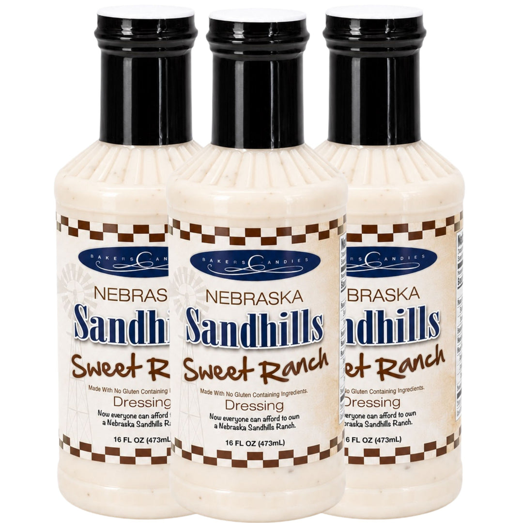 Three bottles of Nebraska Sandhills Sweet Ranch dressing on a white background