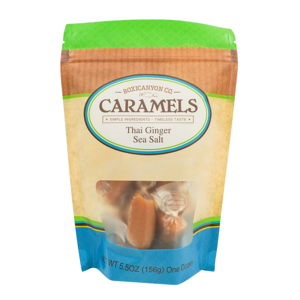 Packaged caramels with Thai Ginger Sea Salt flavor on a white background