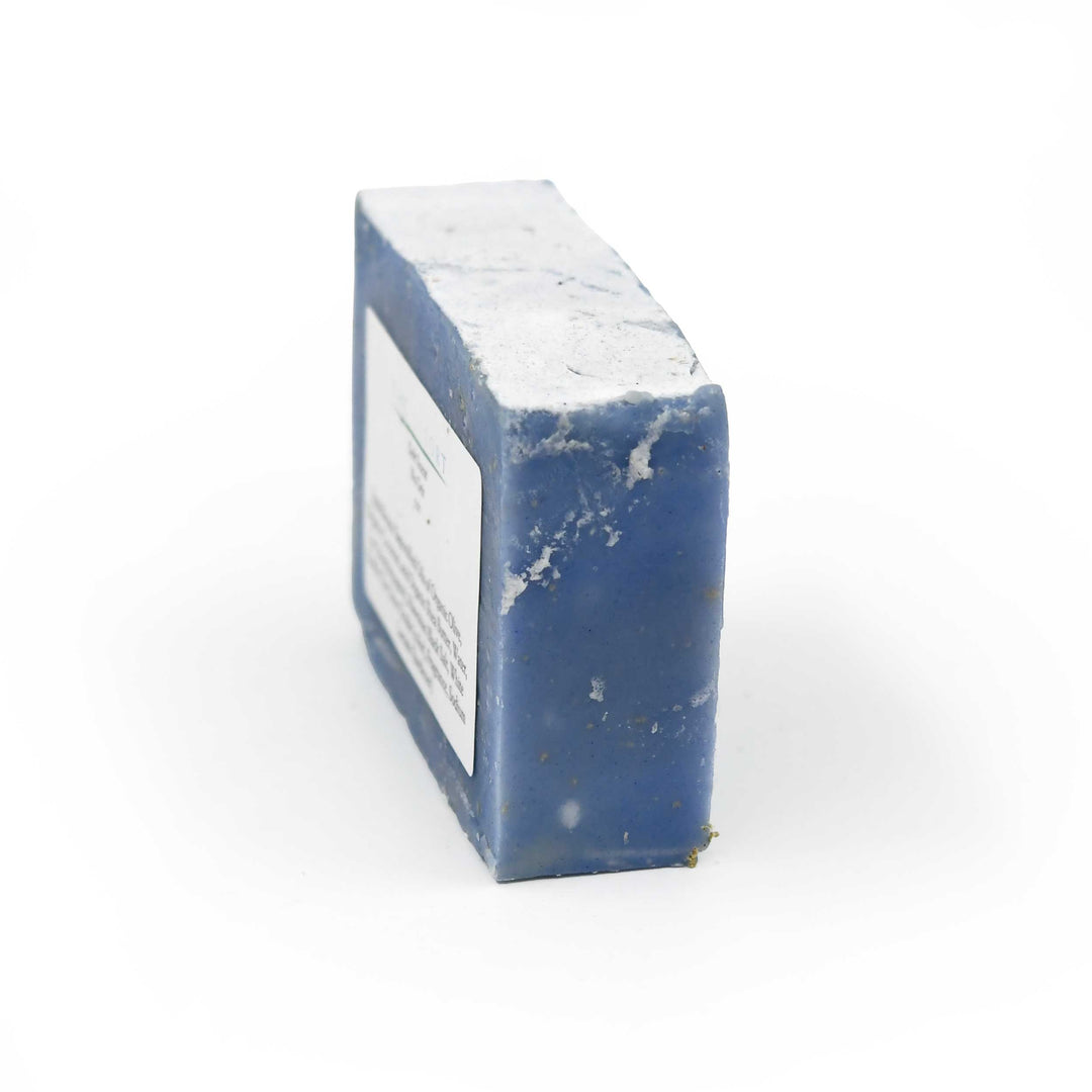 Blue rectangular bar of soap with a white label on a white background