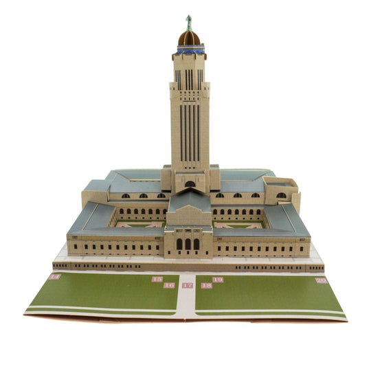 Model of a large building with a prominent tower on a white background
