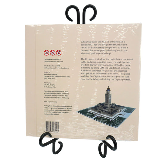 Back cover of a book with text and a small illustration of a tower on a white background