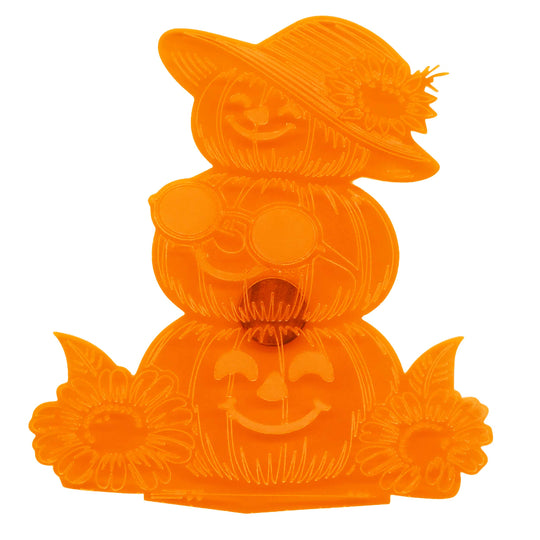 An orange plastic Halloween decoration shaped like a stacked trio of jack-o'-lanterns, with the top pumpkin wearing a hat and sunflower, the middle wearing round sunglasses, and the bottom smiling with sunflower accents.