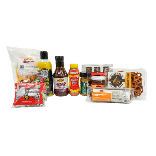 Assorted food products including snacks and condiments on a white background