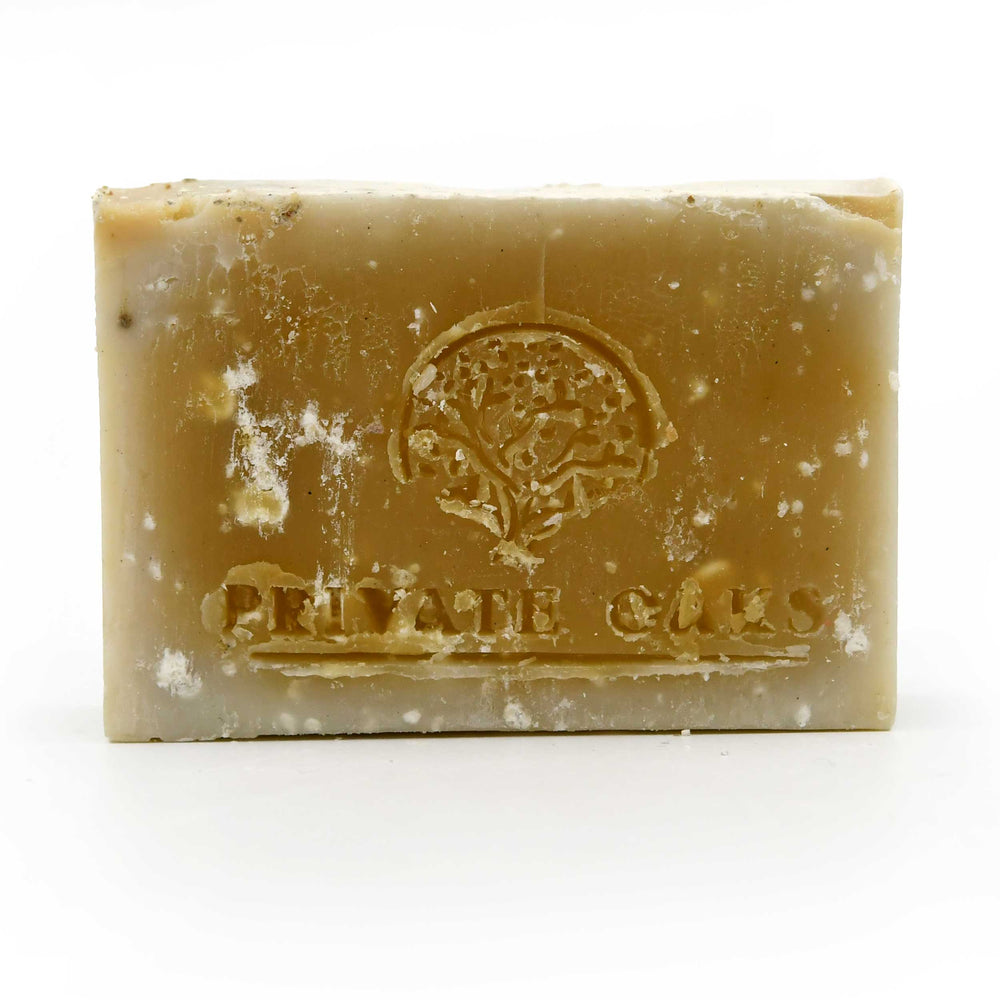 Bar of soap with a visible brand logo on a white background